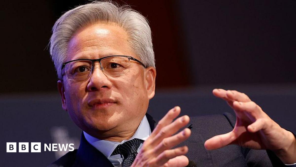 Millie Bobby Brown and David Harbour in character as Eleven and Jim Hopper. Eleven wears red shorts over grey leggings and a grey jumper. Jim Hopper wears a black leather jacket, a black beanie hat and dark trousers.They are speaking to director Frank Darabont on the set of Stranger Things. There is a vintage advertisement posted in the background with debrief on the ground.