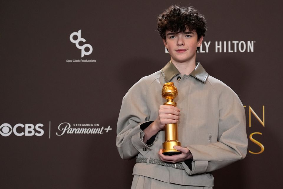 Owen Cooper poses in the press room with the award for best performance by a male supporting actor in a television series (Chris Pizzello/AP)