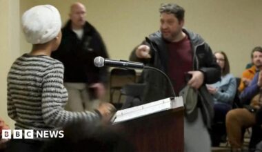 Donald Trump, seen in profile, stands at a podium to deliver a speech in Iowa on Tuesday.
