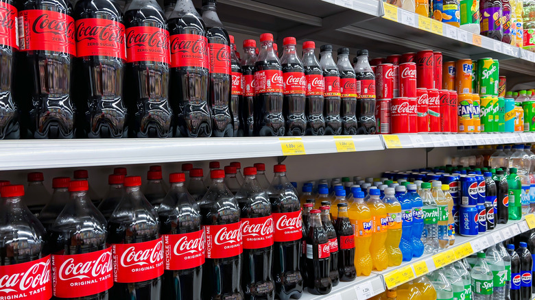 Rows of different sodas in a grocery store