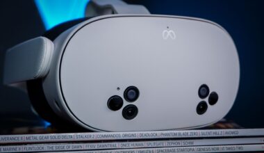 A Meta Quest 3S, alongside a Quest 3 and Quest 2, on a stack of PC Gamer magazine.