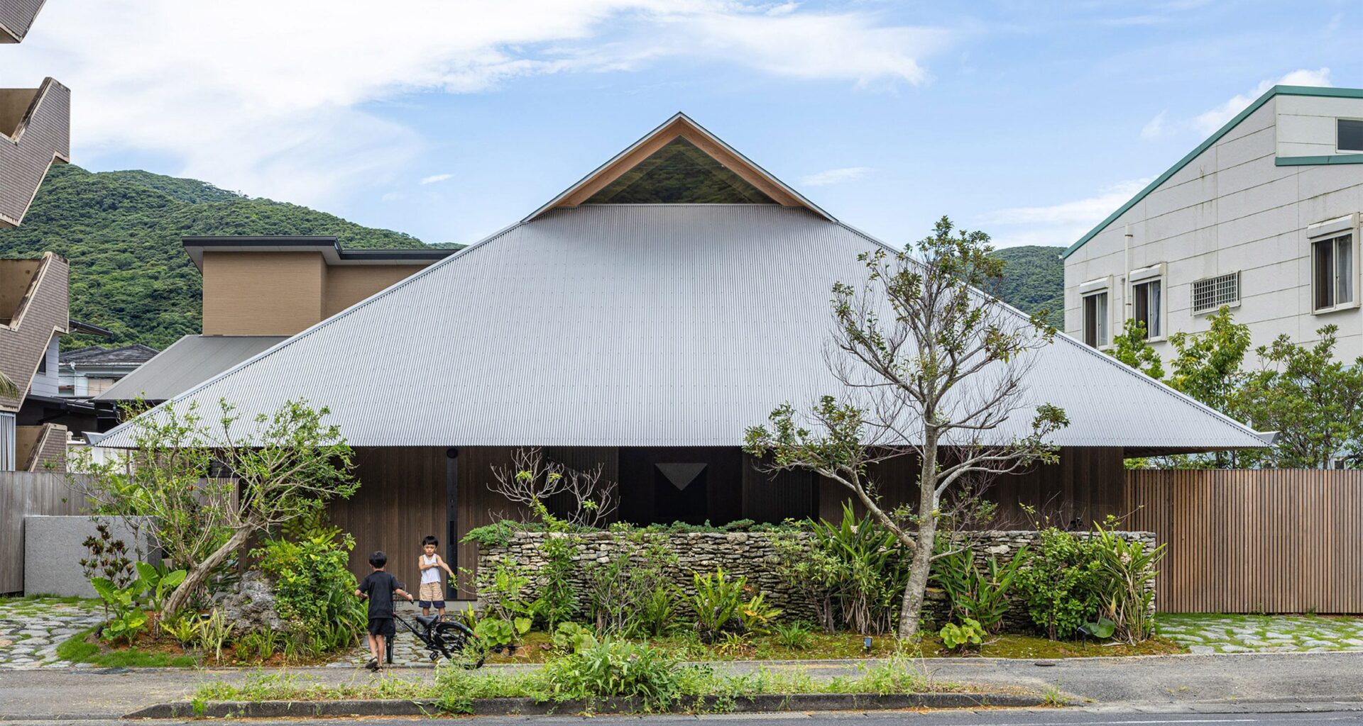 Large metal roof tops off-grid home on Japanese island by Sakai Architects