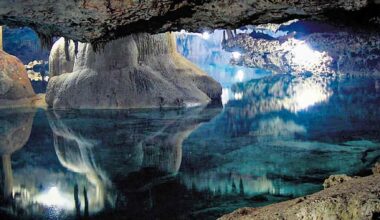 Underground cave lake with turquoise water and mineral formations, used as an illustration for Earth’s “hidden ocean” discovery.