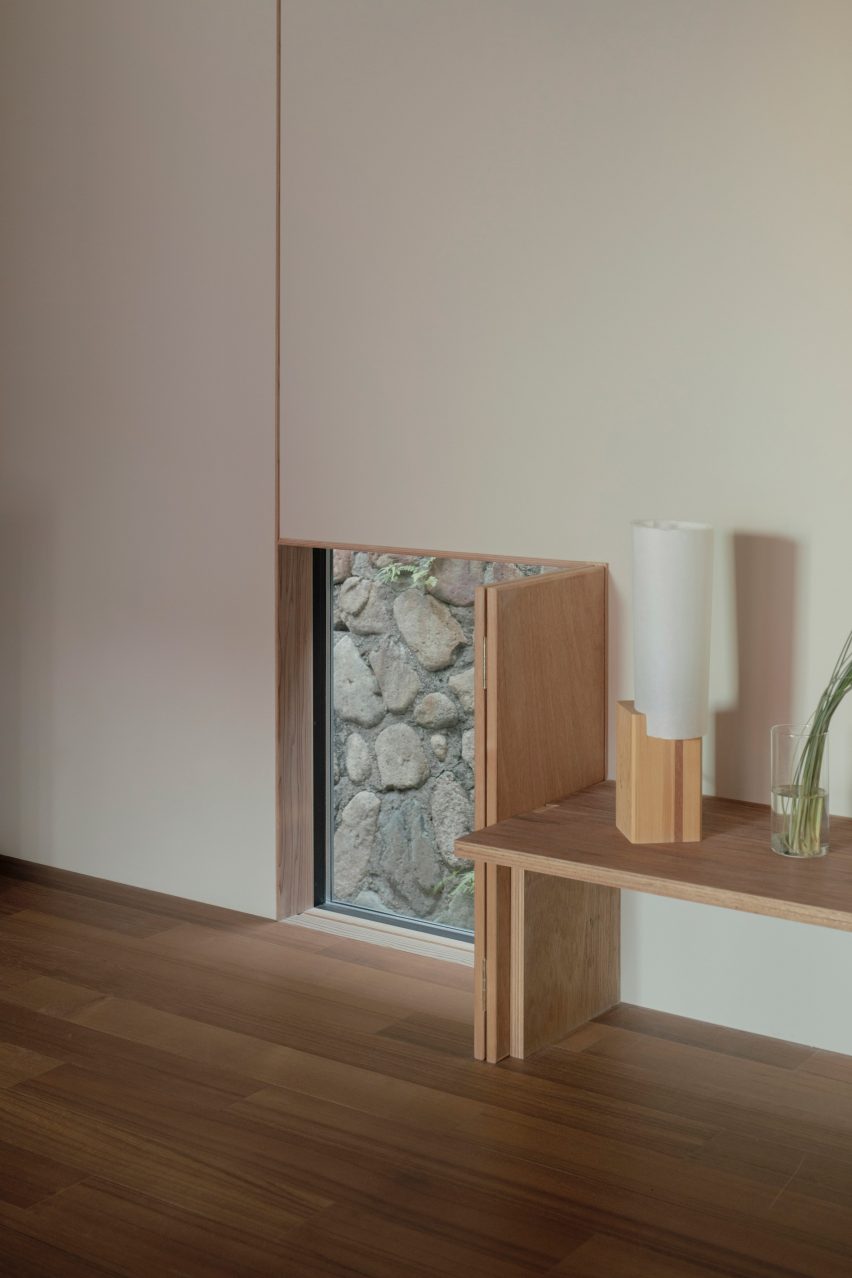 Floor-level window with wooden shutters