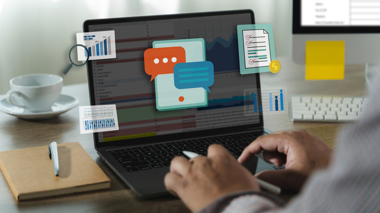 An illustration showing various icons as a person works on a laptop