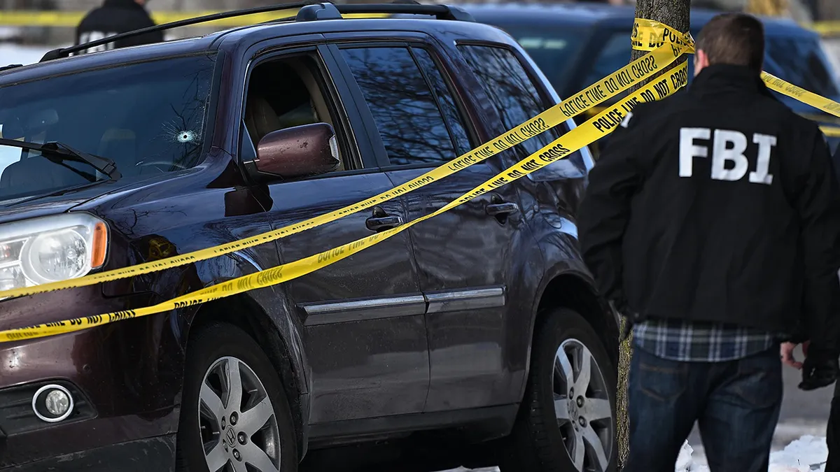 Law enforcement officers work the scene of a shooting involving federal law enforcement agents, Wednesday, Jan. 7, 2026, in Minneapolis. (AP Photo/Tom Baker)
