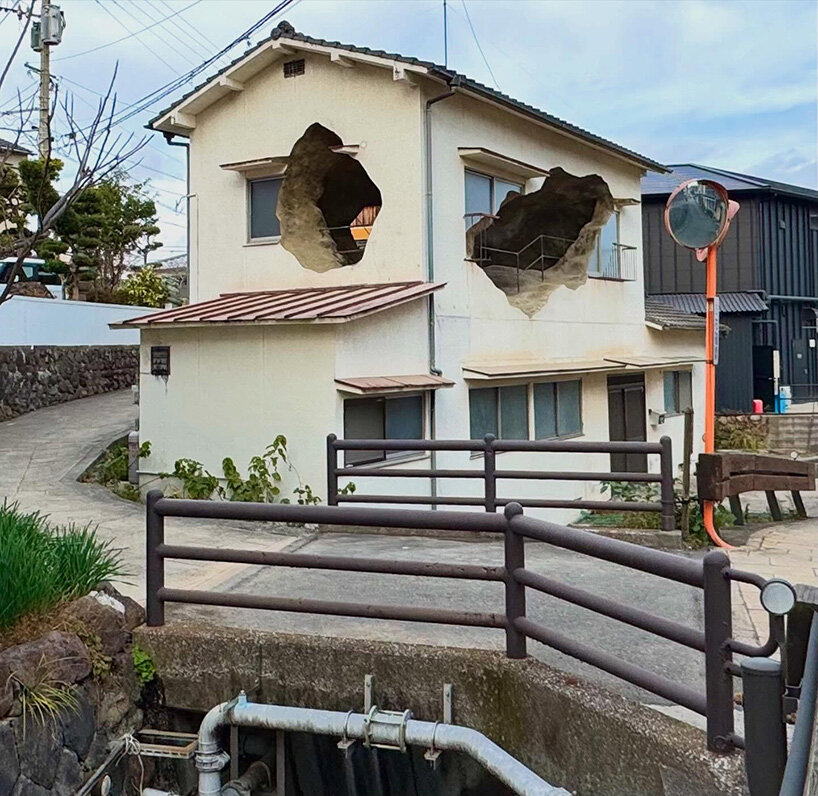 irregular voids carve cave-like, geological interior inside japanese residence