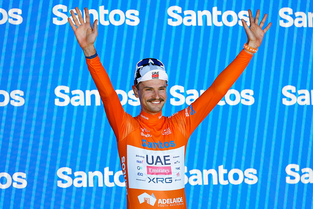 NORWOOD, AUSTRALIA - JANUARY 22: Jay Vine of Australia and UAE Team Emirates celebrates at podium as Orange Santos Leader&amp;apos;s Jersey winner during the 26th Santos Tour Down Under 2026, Stage 2 a 148.1km stage from Norwood to Uraidla 495m / #UCIWT / on January 22, 2026 in Norwood, Australia. (Photo by Con Chronis/Getty Images)