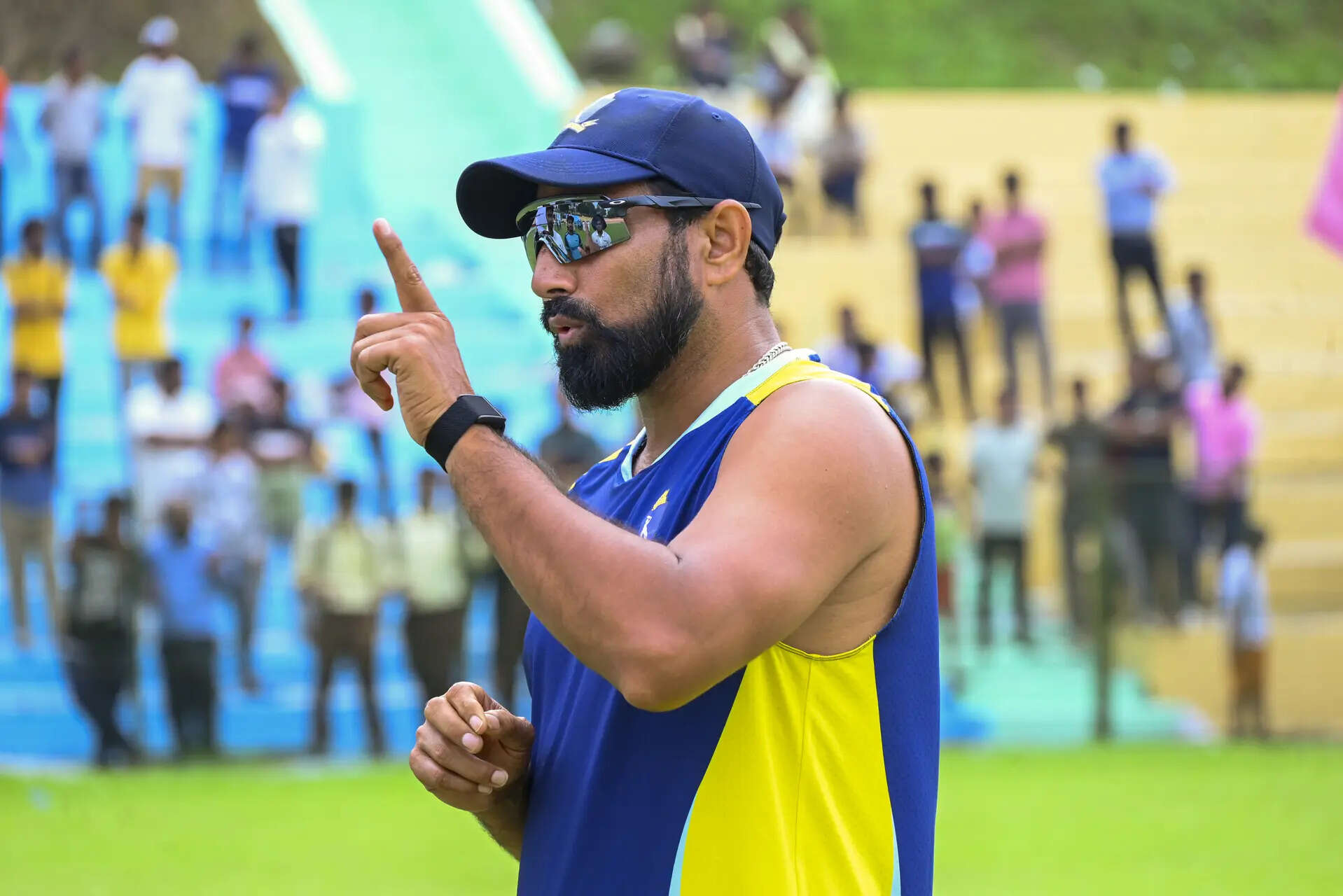 India's pacer Mohammed Shami engages in a discussion with Bengal team members during a training session at the Maharaja Bir Bikram Stadium, in Agartala, Tripura. (PTI Photo)(PTI11_04_2025_000253B) Mohammed Shami at a training session in Agartala