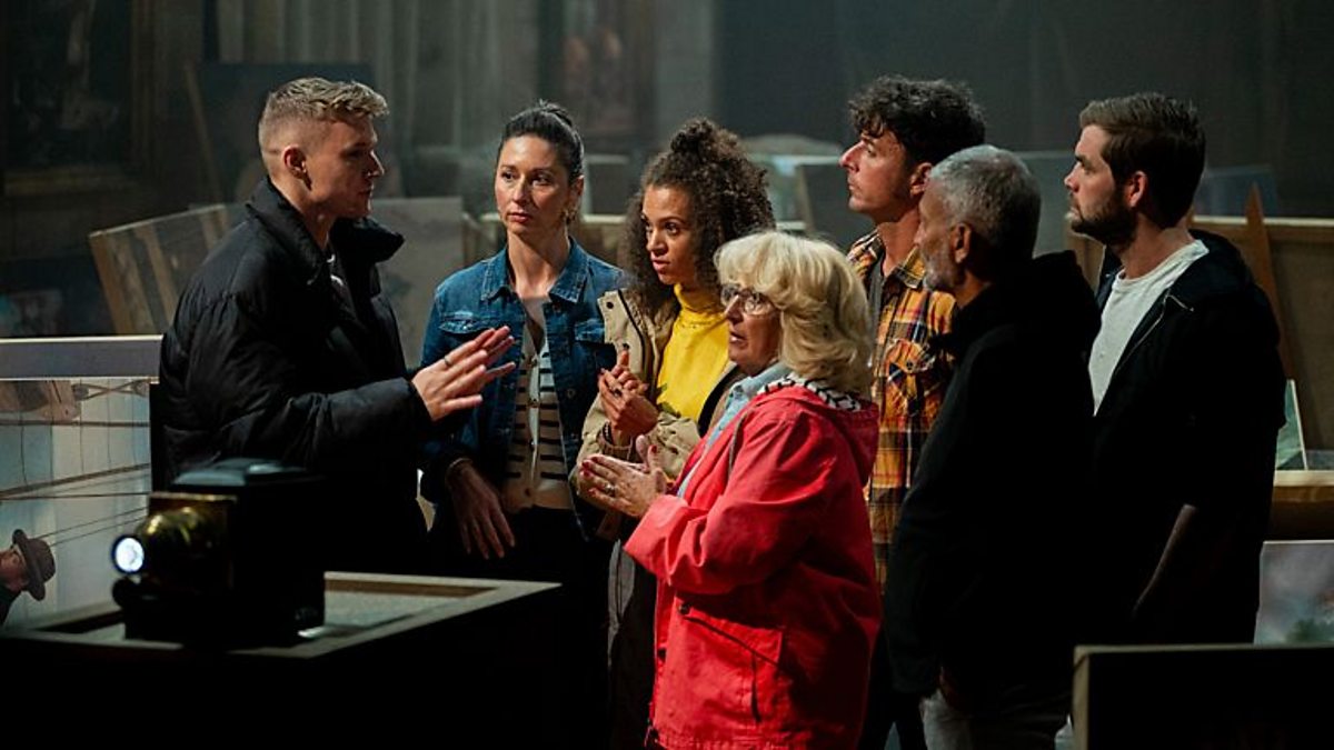 An image of discussion taking place around the round table in an episode of The Traitors