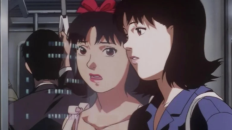 Animated character Mima standing on subway looking at a version of herself in the reflection in Perfect Blue