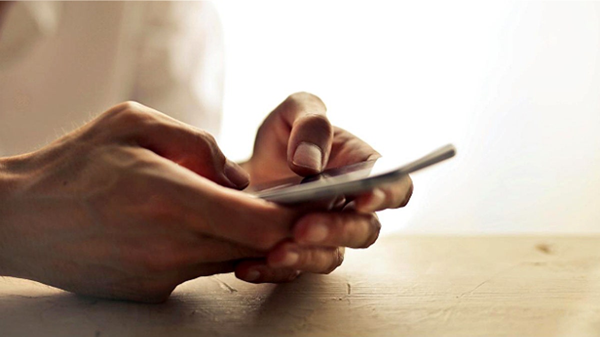 Person holds a phone