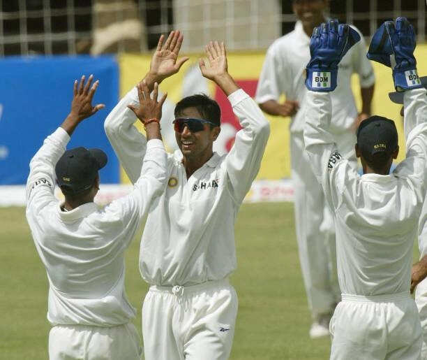 Rahul Dravid (2nd left) high fives teammate Shiv Das (L) after getting a catch out on West Indies batsman Ridley Jacobs during the 2002 4th Test Match Cricket Series 14 May at the Antigua Recreation Grounds in St. Johns, Antigua. (Photo/Getty)