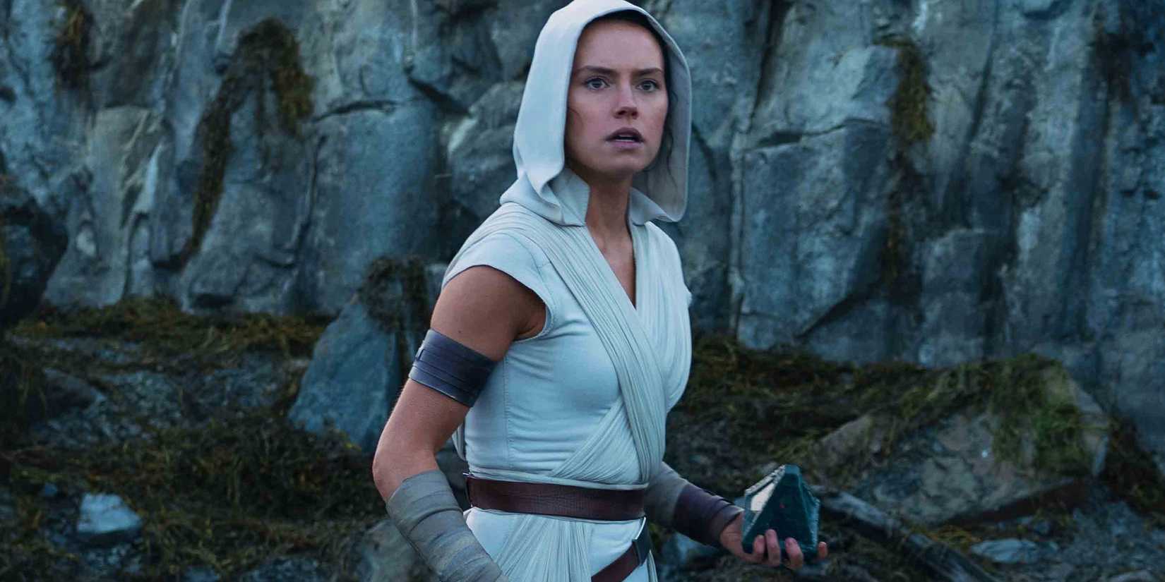 Rey in The Rise of Skywalker holding a holocron