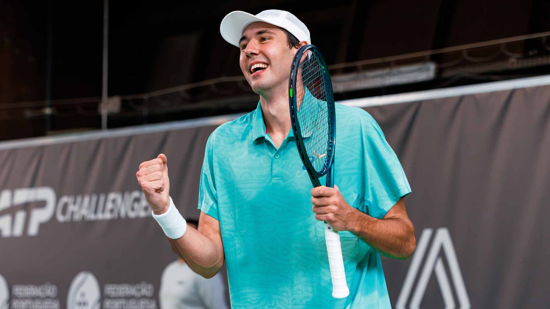 Chris Rodesch celebrates winning the Oeiras Challenger.
