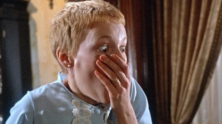Mia Farrow as Rosemary looking shocked with hand over her mouth in Rosemary's Baby