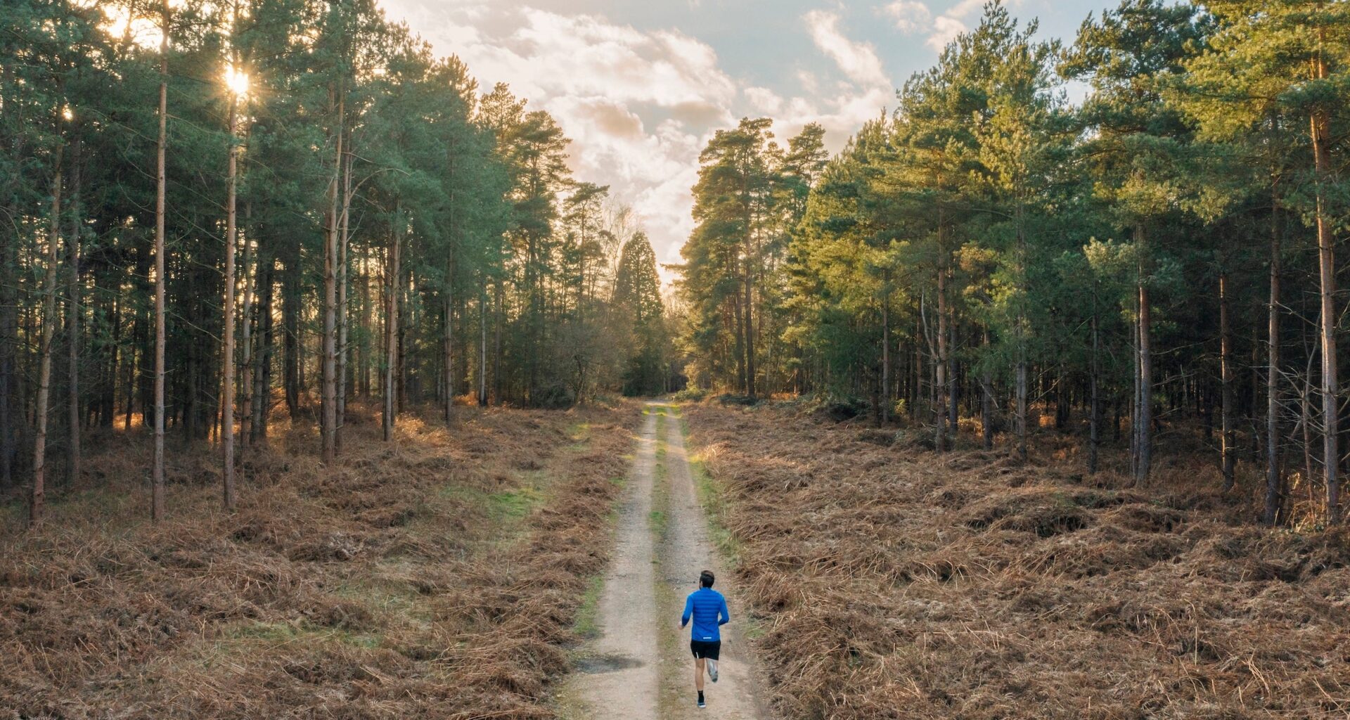 man running through woods