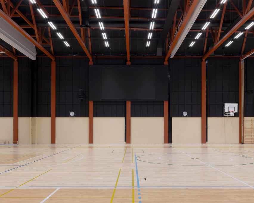 Sports hall interior at Sammontalo by NERVIN Architecture