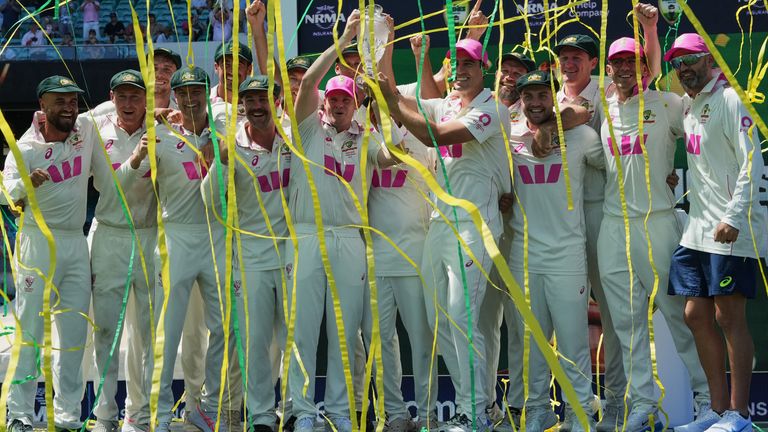 Australia's players celebrate with the Ashes trophy after winning the final Test against England in Sydney. Pic: AP