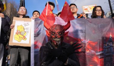 Representatives from the Inter-Parliamentary Alliance on China and other China critics demonstrate outside Royal Mint Court. Pic: PA.