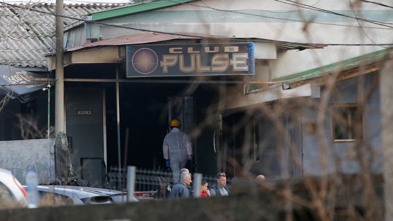 A forensic investigator enters the burnt out Pulse night club in Kocani. Pic: Reuters