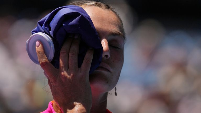 Aryna Sabalenka of Belarus places an ice pack to her face during their quarterfinal match against Iva Jovic of the U.S. at the Australian Op