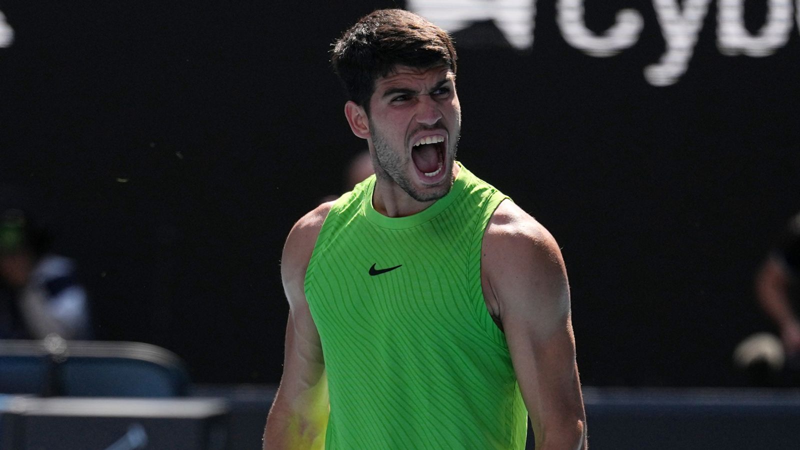 Carlos Alcaraz of Spain reacts after winning his fourth round match against Tommy Paul of the U.S. at the Australian Open tennis championship in Melbourne, Australia, Sunday, Jan. 25, 2026. (AP Photo/Dita Alangkara)