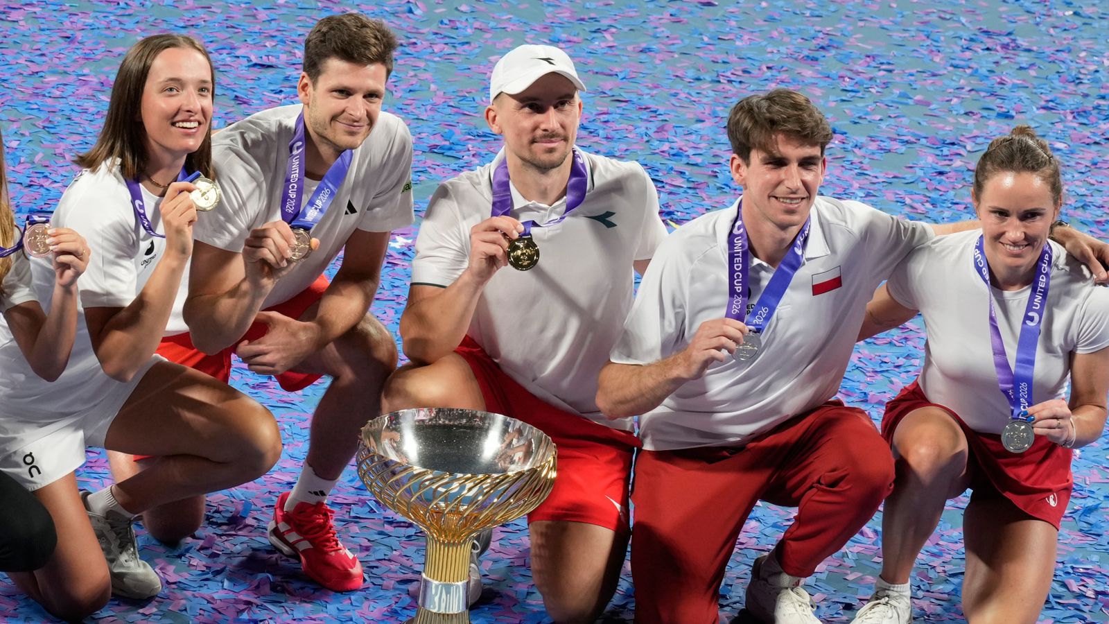 Poland celebrate with the trophy after winning the 2026 United Cup in Sydney (Associated Press)