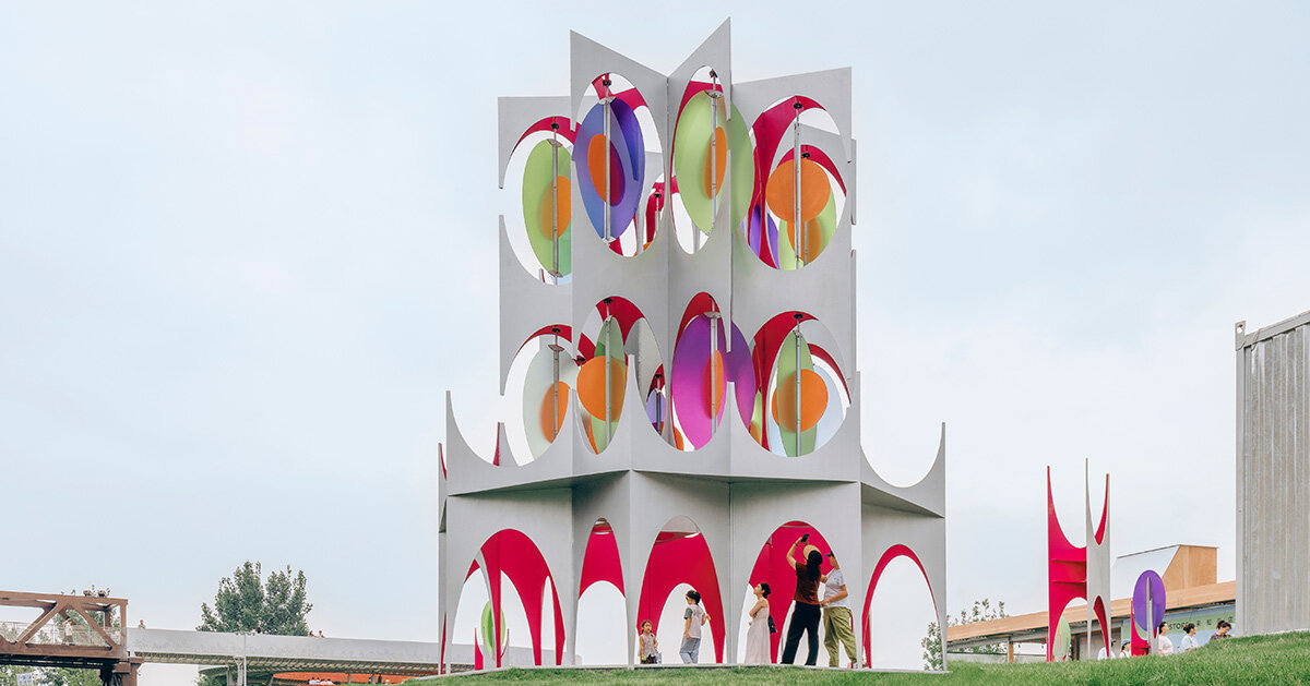 colored discs move through daxing jizi design's installation in beijing