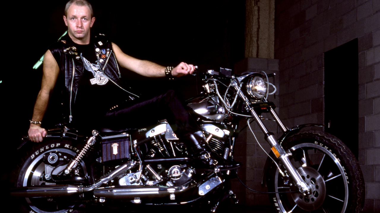 Rob Halford of Judas Priest on a motorbike in 1982