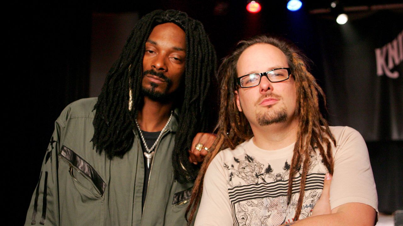 Jonathan Davis and Snoop looking at the camera with serious expressions