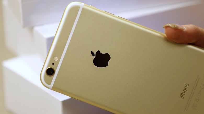 The back of a gold color iPhone 6 Plus