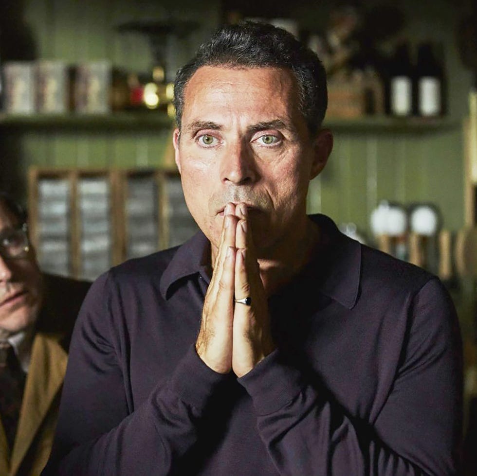 two individuals in an intimate setting one appearing distressed