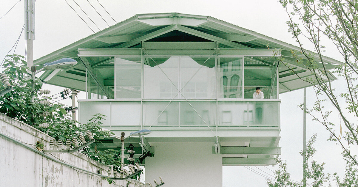 tiny bookstore by SZ-architects crowns former prison tower in china