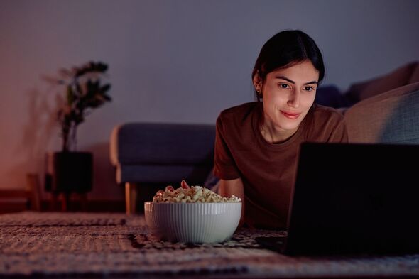 Woman watching movie on laptop
