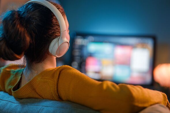 woman watching TV at home