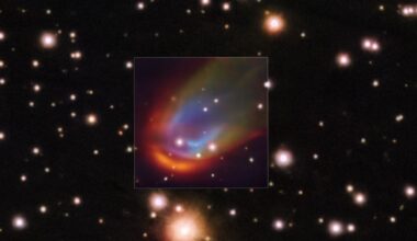 Image showing a multicolored bow shock surrounding a distant star