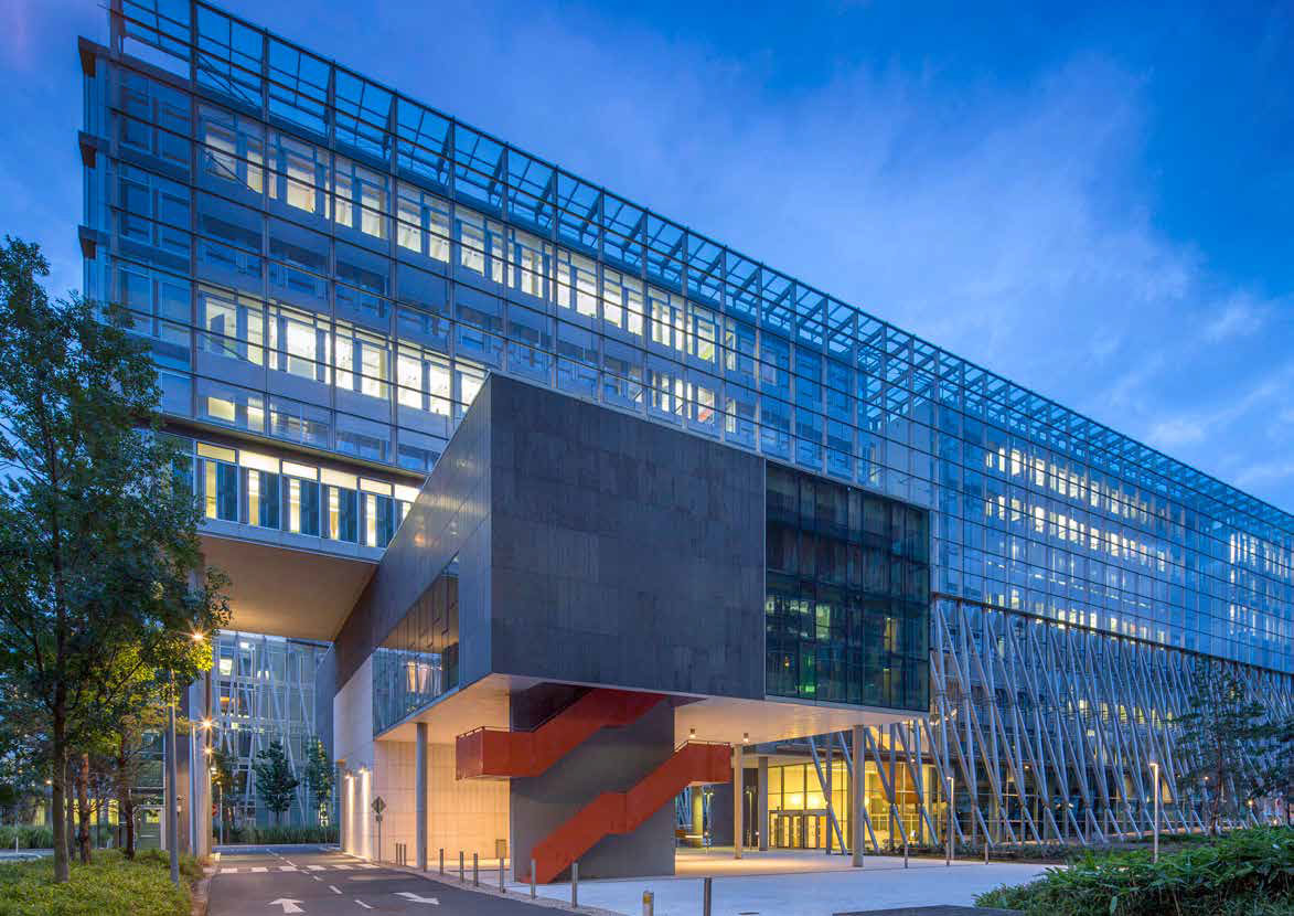 The Vista Building in Elmpark, also known as the Novartis building in Elm Park, Dublin 4, with lights on in many windows.