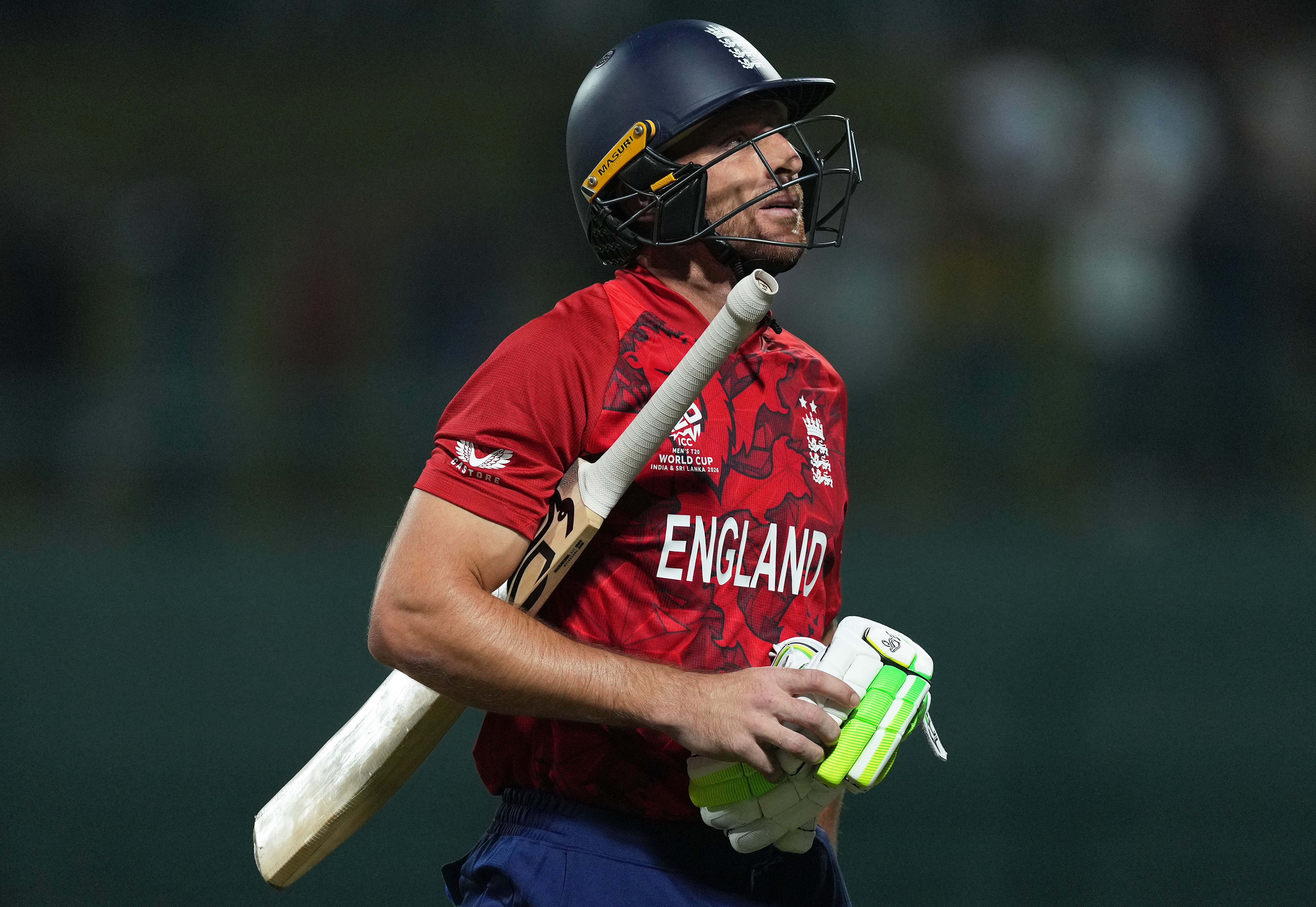 Jos Buttler walking off the field after being dismissed during the ICC Men's T20 World Cup.