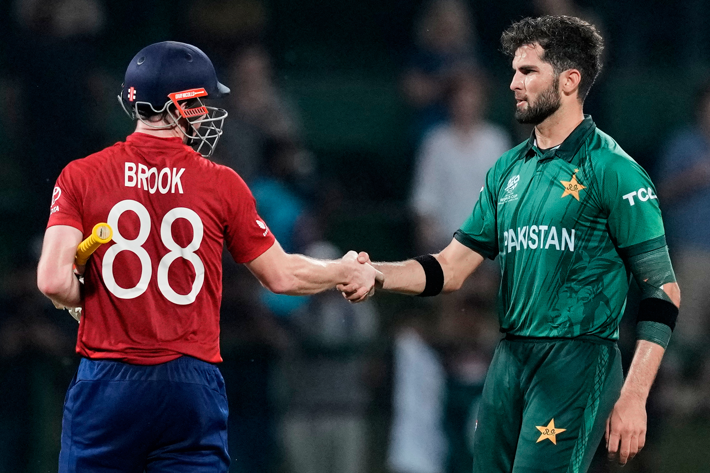 Pakistan's Shaheen Shah Afridi shakes hands with England's Harry Brook during a T20 World Cup cricket match.