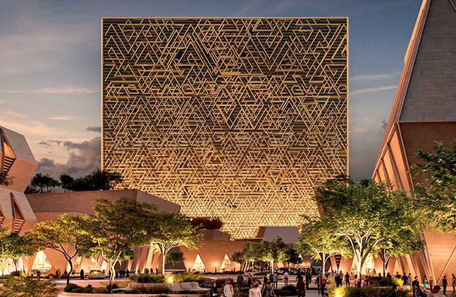 Illustration of the Mukaab building with a geometric patterned exterior towering over an open plaza with trees and people.