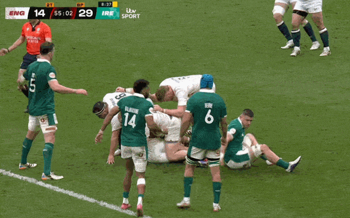 A scrum in a rugby match between England and Ireland, with the score England 14, Ireland 29.