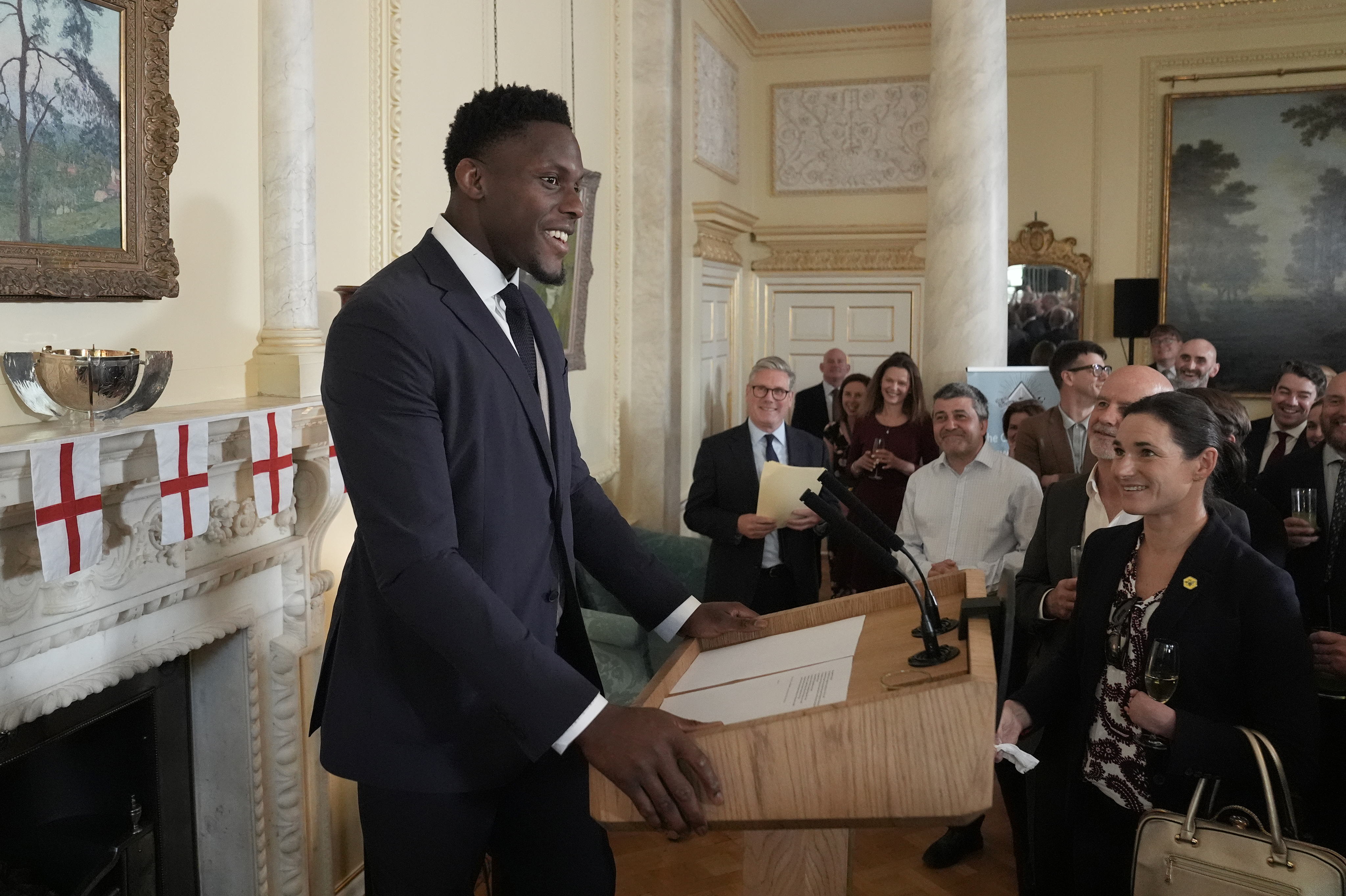 Prime Minister Sir Keir Starmer listens to Maro Itoje speaking during a reception to celebrate St George's Day at 10 Downing Street.