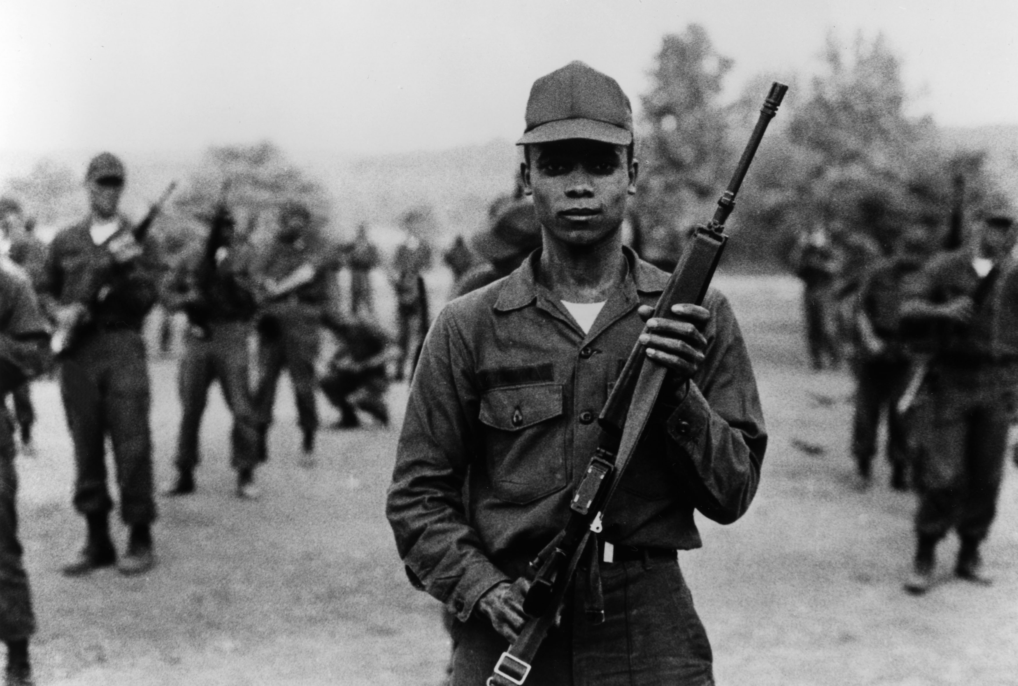 Frederick Wiseman's Basic Training scene with a young man holding a rifle.