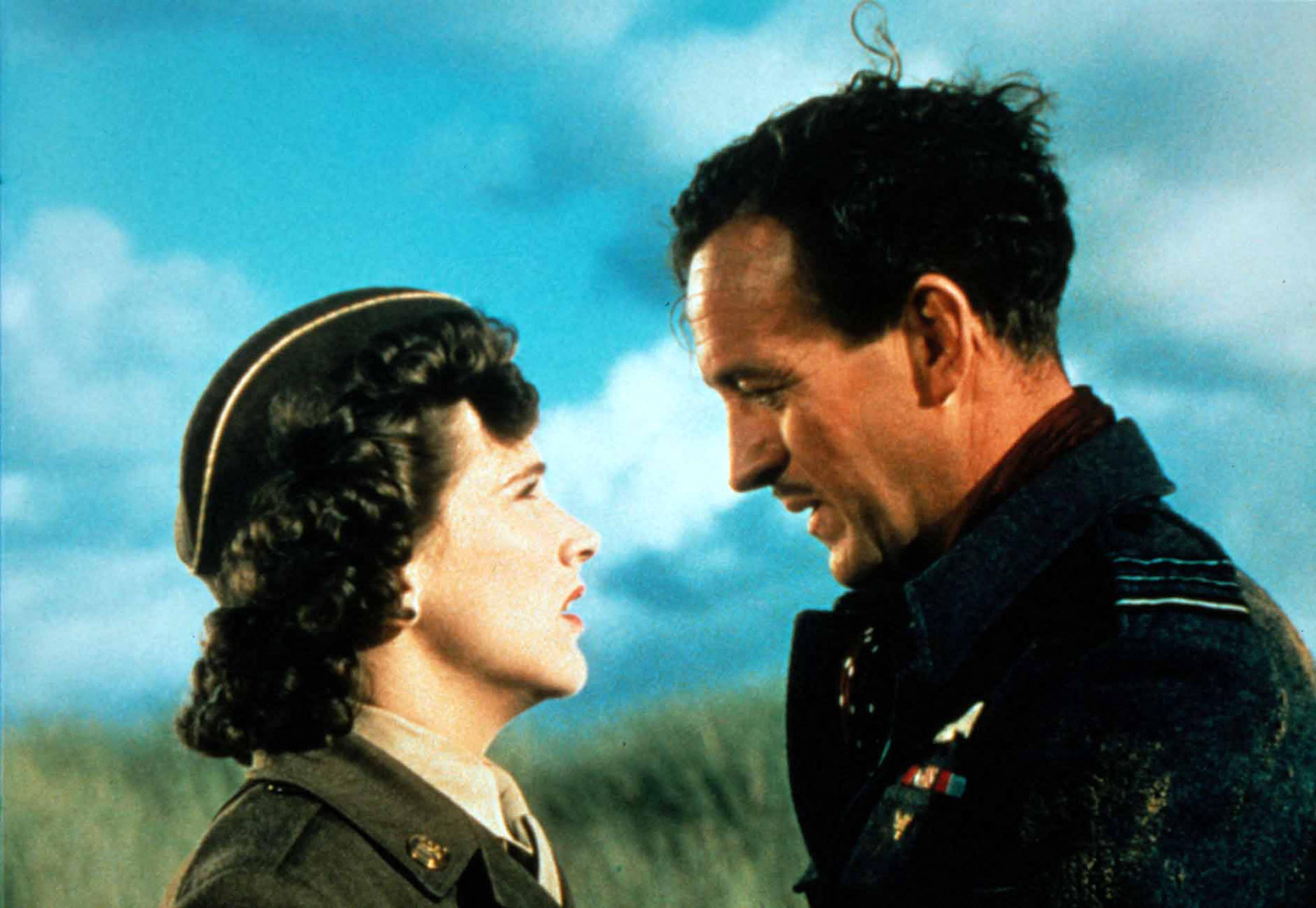 Kim Hunter and David Niven looking at each other intensely against a blue sky.