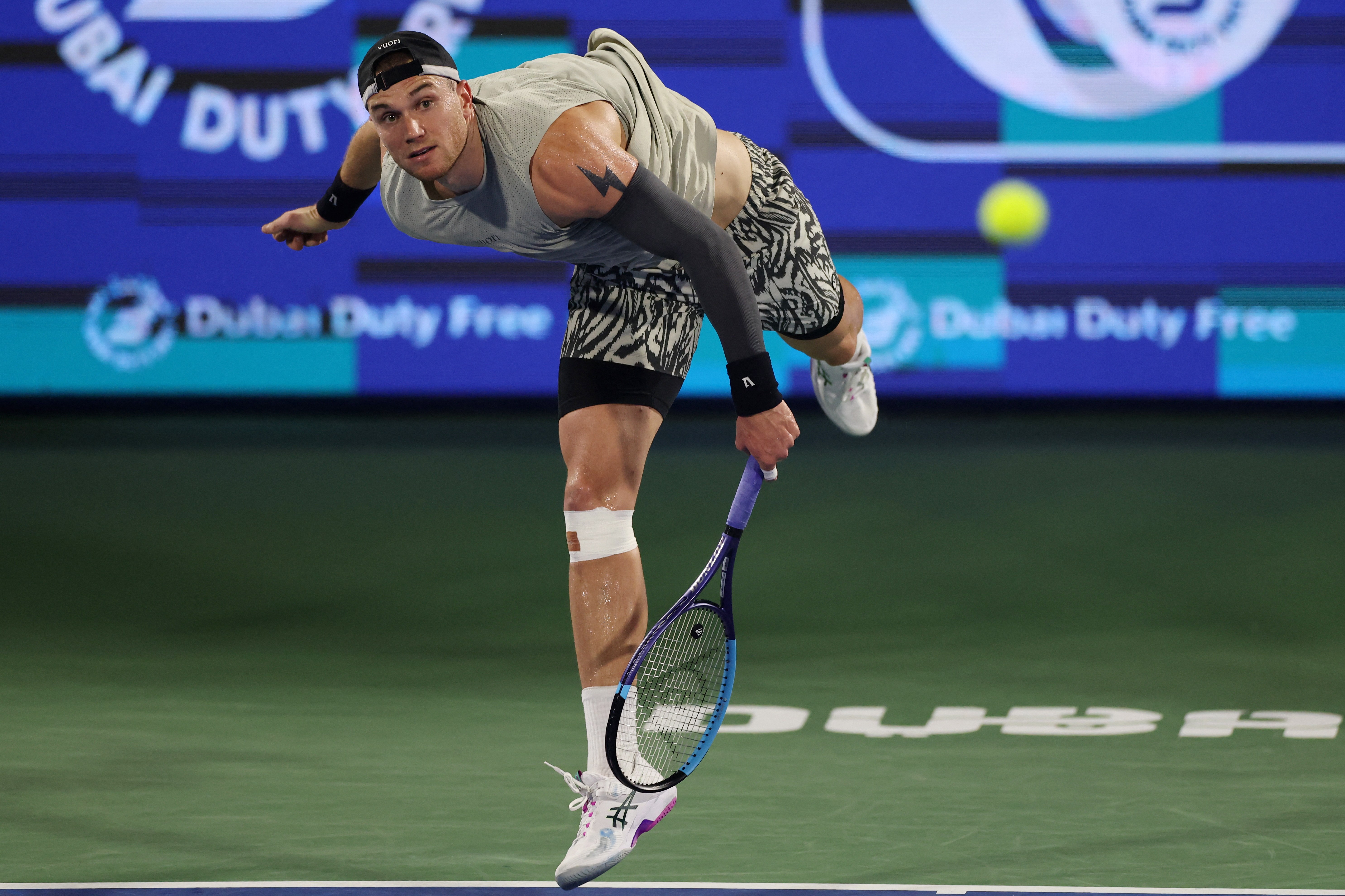 Britain's Jack Draper serves during his match against France's Quentin Halys at the Dubai Tennis Championships.