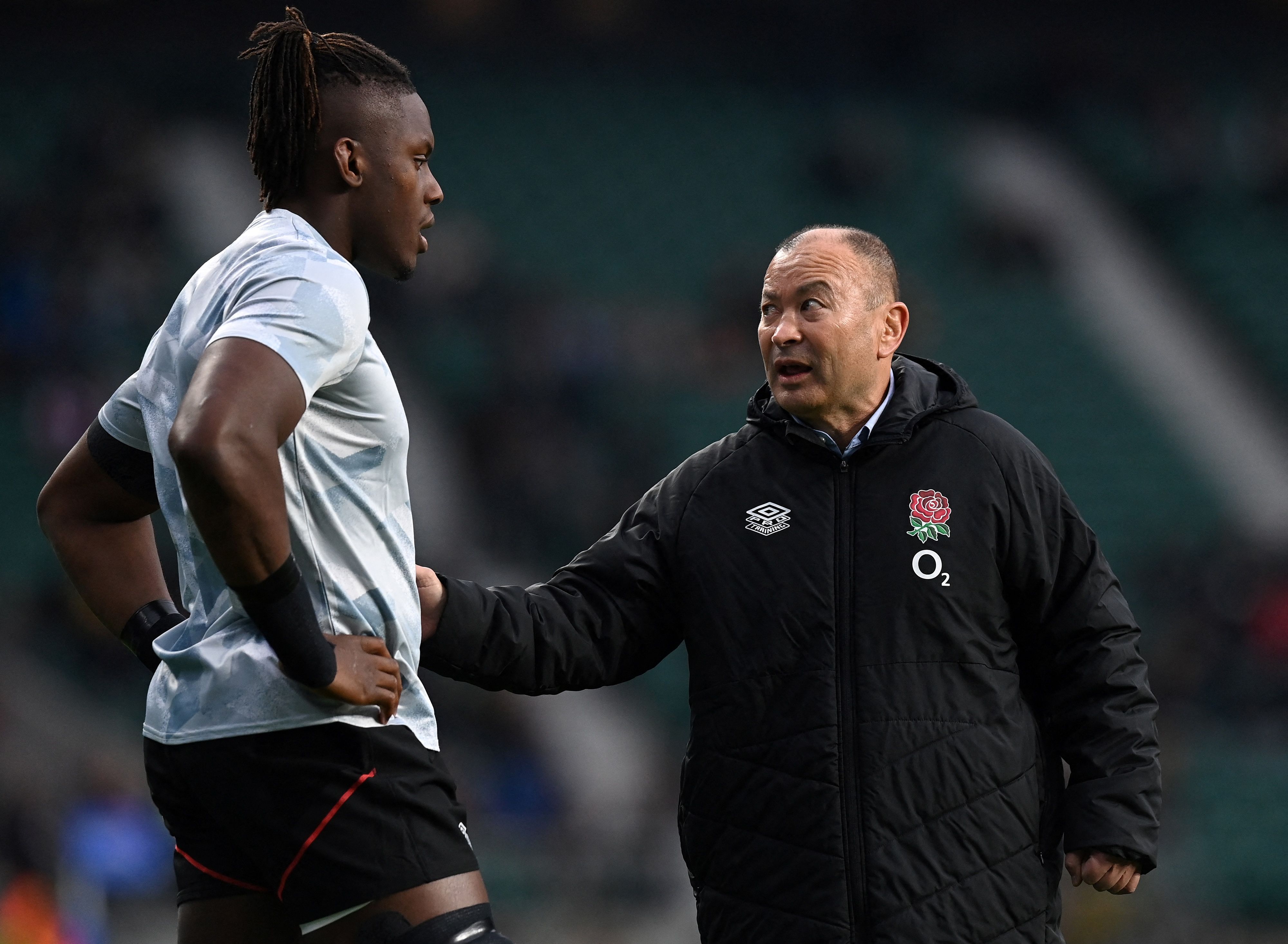 England's coach Eddie Jones talks to England's lock Maro Itoje.