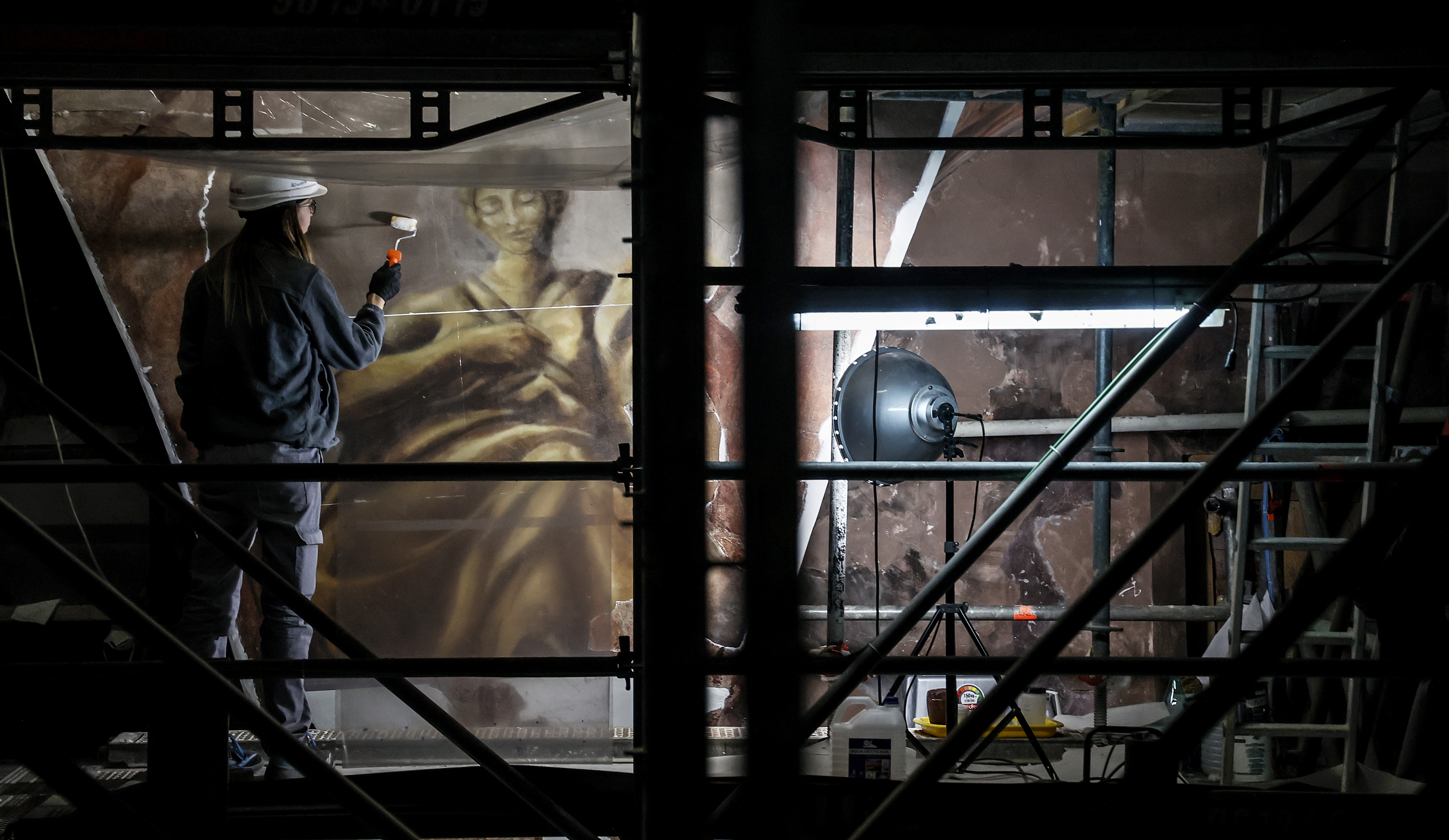 Restoration worker treating the fresco in the Church of Santos Juanes in Valencia.