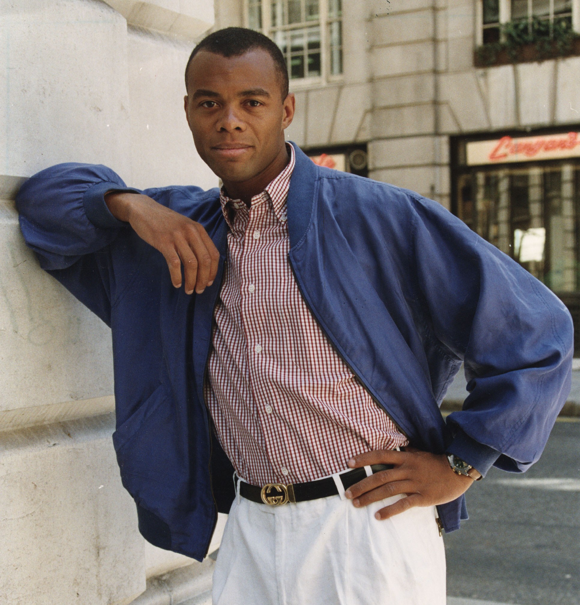 Andrew Harriman, Harlequins and England rugby union player, posing in a blue jacket and white pants.