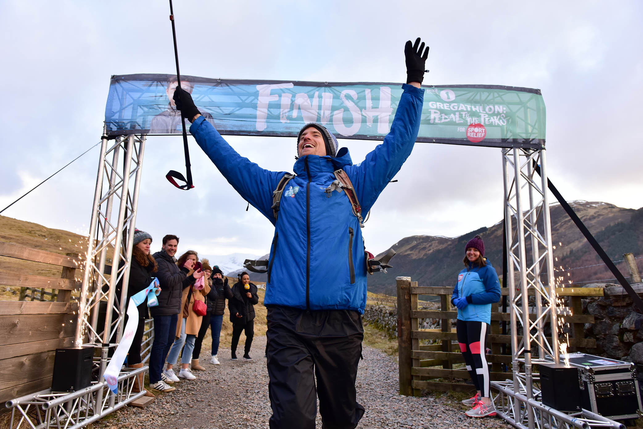 Greg James celebrating the completion of Radio 1's Gregathlon: Pedal to the Peaks for Sport Relief.